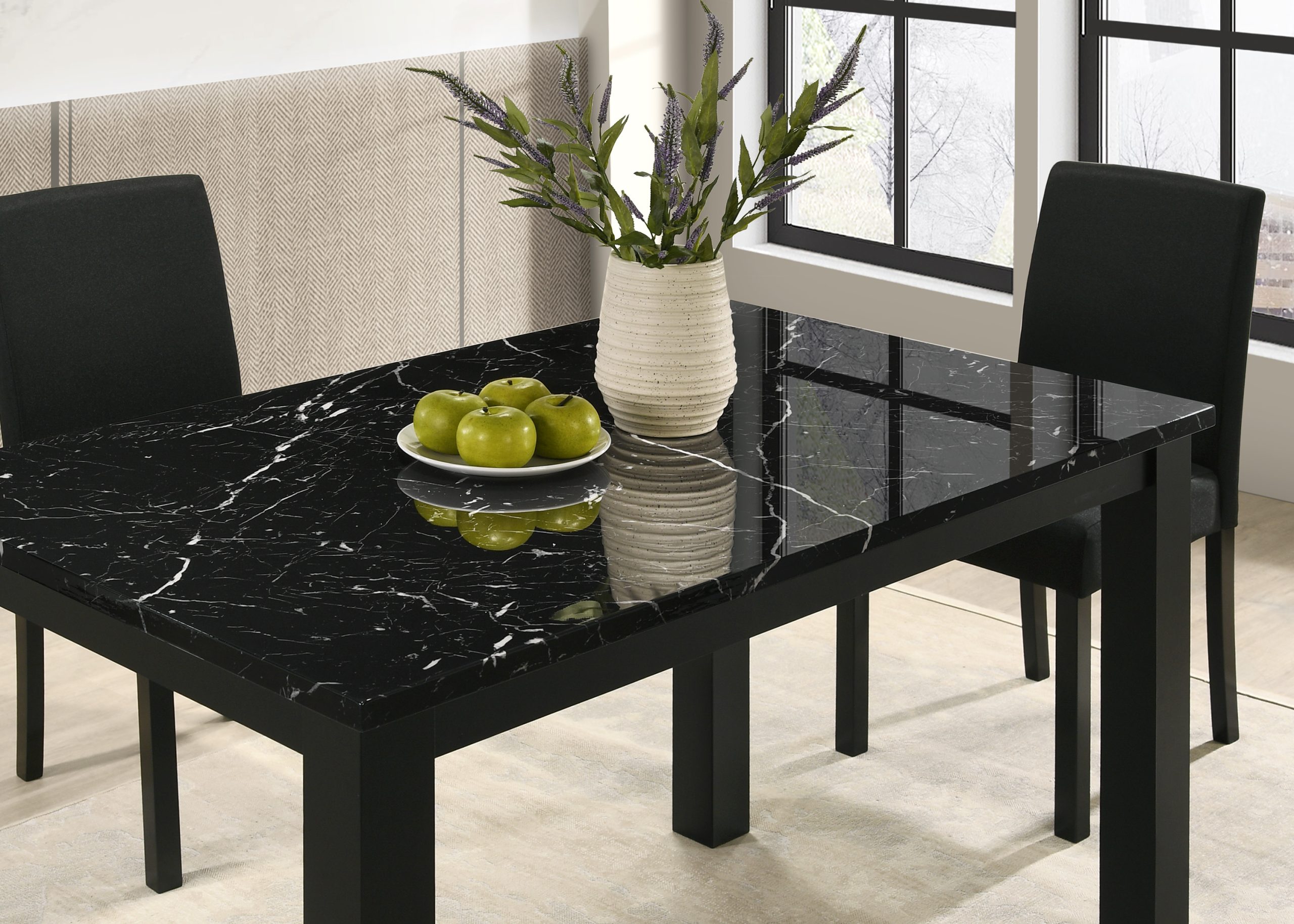 The #2120BK "Resia" Dining Set in Black features a glossy black marble table, paired with black chairs and accented by green apples and a vase of green and purple foliage, set near large windows.