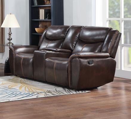 The Marisol Chocolate PU Vinyl Motion Set (#LR81743CH) loveseat with center console sits on a wooden floor near a patterned rug, with a lamp, bookshelf, and large windows providing natural light in the background.